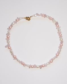 Our Rosebud necklace has rose quartz (hello welcoming love and positive vibes), dyed pink glass pearls and genuine freshwater pearls! Pink Pearl Drop Beaded Necklaces With Round Beads, Pink Pearl Beaded Necklace With Pearl Charm, Delicate Pink Pearl Necklace, Pink Pearl Necklace With Round Beads, Pink Pearl Necklace With Round Natural Stones, Pink Pearl Necklace With Natural Round Beads, Pink Necklaces With Pearl Charm And Round Beads, Feminine Pink Pearl Necklace, Pink Pearl Necklaces With Natural Stones