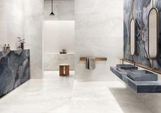 a modern bathroom with marble walls and flooring