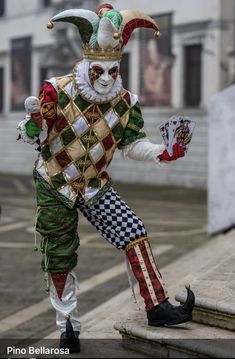 a man dressed as a jester in costume