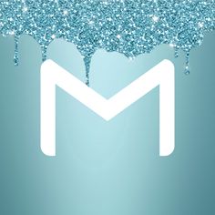 the letter m is made up of blue and white glitters on a light blue background