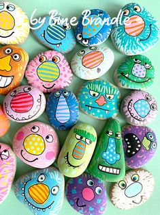 colorful painted rocks with cartoon faces on them