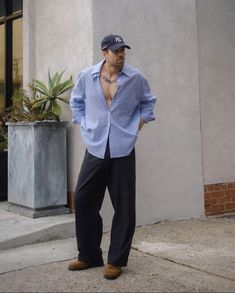 a man standing in front of a building