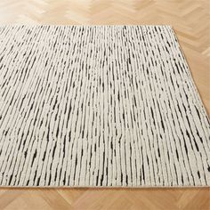 a white rug with black lines on it