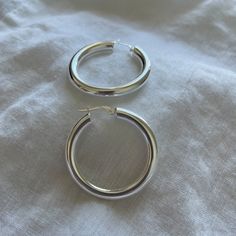 These bright .925 Sterling Silver hoop earrings will be a perfect touch of your style. SHIPS NEXT DAY All hoops are sold in pairs. * .925 Sterling Silver Hoops. They are hypoallergenic, safe for sensitive ears. - XLarge Hoop Earrings 40 mm (4cm) (1.57 inch) If you want to buy gold, https://www.etsy.com/listing/840477349 * All of our jewelry arrives carefully packaged in a free jewelry bag. It's ready for gifting. * If you want a personalized message sent with the order to your recipient, the opt Everyday White Gold Hoop Earrings, Sterling Silver Hoop Earrings For Everyday, Silver Small Hoop Earrings For Everyday, Silver Round Hoop Earrings For Everyday, Minimalist Hoop Earrings With Shiny Finish, Everyday Sterling Silver Hoop Earrings With Shiny Finish, Shiny Finish Hoop Earrings As Gift, Gift Hoop Earrings With Shiny Finish, Hypoallergenic Sterling Silver Hoop Earrings