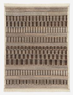 a brown and white rug with squares on the bottom, two rows of lines in the middle