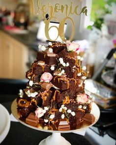 a cake that is sitting on top of a white plate with the number 60 on it