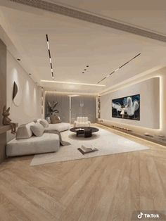 a modern living room with white furniture and wood flooring is lit by recessed lighting