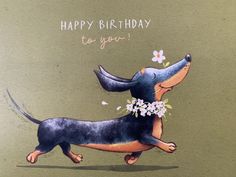 a happy birthday card with a dachshund holding flowers