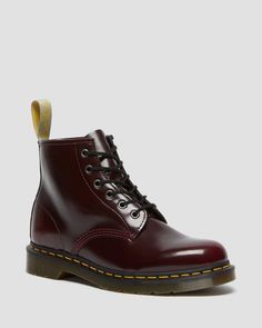 With 6 eyes, the 101 sits lower on the ankle — but is still an instantly recognizable Dr. Martens silhouette. Clean, sharp and solid, the boot combines utilitarian work wear with classic lines, puritan stitching and unmistakable attitude. This version of the boot is 100% vegan, using a black synthetic material called Felix Rub-Off. 100% vegan construction Adopted by workers. Subverted by rebels. Clean, sharp and bold, our 6-eye 101 boot combines classic utilitarian workwear with unmistakable Dr. Cherry Red Dr Martens, Red Dr Martens, Clothes Wishlist, Vegan Boots, Boots Uk, M 4, Goodyear Welt, Danner Mountain Light Boot, Girls Wear