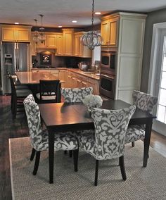 a dining room table and chairs with the word pinterest on it