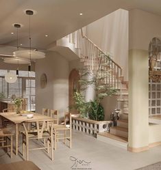 a dining room and living room with stairs leading up to the second floor, along with potted plants