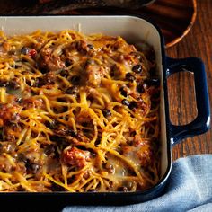 a casserole dish filled with meat and cheese