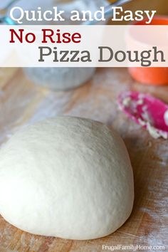 a pizza dough sitting on top of a wooden cutting board