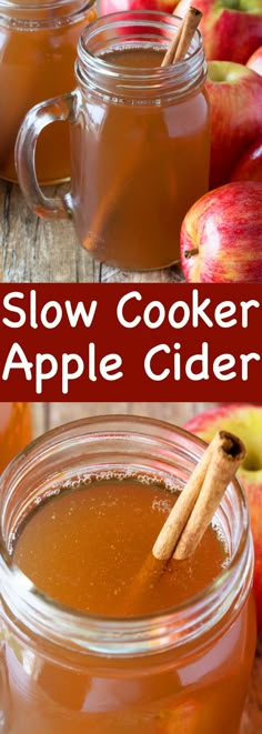 two jars filled with apple cider sitting on top of a wooden table next to apples