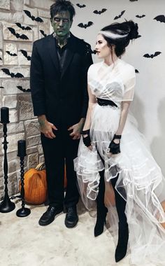 a man and woman dressed up in halloween costumes