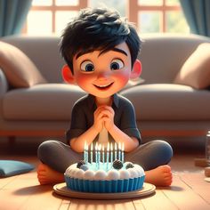 a boy sitting on the floor in front of a birthday cake