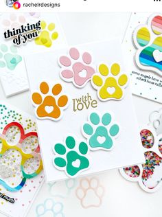 some cards with different colored paw prints on them