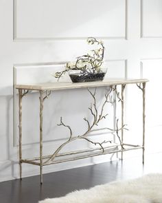 a white table with flowers and a basket on top