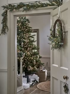 a christmas tree is hanging on the door