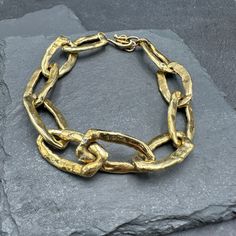 Heavy organically shaped brass links from raw brass connect to create a bold bracelet adjustable between 8 1/2 and 9 inches. Handmade in Lakewood, CO. Modern Hand Cast Gold Bracelets, Gold Brass Jewelry With Chunky Chain, Brass Chain Link Jewelry With Chunky Chain, Brass Chain Link Bracelet, Brass Chain Bracelet Bold Chunky, Brass Jewellery Handmade, Gold-tone Chain Link Brass Bracelets, Jewelry Education, Organic Jewelry