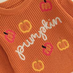 an orange sweater with the words pumpkin on it