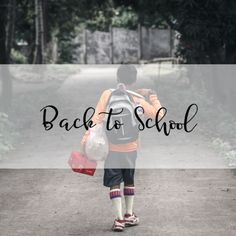 a young boy walking down a dirt road with a back to school bag on his shoulder