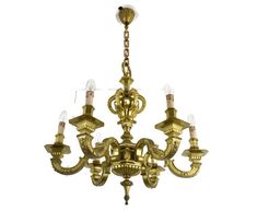 an antique brass chandelier with five lights