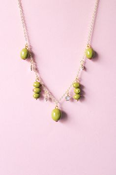 Please welcome the green olive charms necklace made of polymer clay. Get a matching pair of green olive earrings too as Spring/Summer is approaching. 👉🏼 Made to order  👉🏼 Hand sculpted charms 📐 Total Length: 20 inches (including 3 clasp holes for length adjustment) Due to the handmade nature of our products, there may be slight variations in color and/or craftsmanship. Copyright © 2024 Crafted by Levi. All rights reserved. Do not copy/use/reproduce our work without permission.  ⏳ [Processing Time]  All jewelry that are listed on our Etsy are ready in-stock unless noted otherwise. We typically process your order within 3-5 business days (exclude Saturday/Sunday/Holidays).  💖 [Care Instruction] Please store jewelry in a jewelry box to prevent scratch/breakage. Avoid contact with makeup Olive Green Polymer Clay Earrings, Clay Charm Necklace, Olive Necklace, Olive Earrings, Charms Necklace, Store Jewelry, Handmade Gifts For Her, Polymer Clay Necklace, Necklace Craft