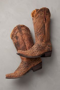 Embrace your edgy side with the western-inspired Leopardito handcrafted leather cowboy boots, featuring an intricate yoke-and-stud design. Made from durable goatskin leather with a distressed leopard print, these sassy boots offer easy on/off with their double pullstraps and smooth calfskin lining. Kick off festival season with this wild yet wearable style that lasts. What To Wear Witb Leopard Cowboe Boots, Luxury Fall Cowboy Boots With Snip Toe, Leopard Print Cowboy Boots, Luxury Snip Toe Cowboy Boots In Country Style, Studded Boots Western, Luxury Snip Toe Cowboy Boots For Spring, Luxury Country Style Cowboy Boots With Snip Toe, Cavenders Women Boots, Luxury Leather Cowboy Boots With Patina