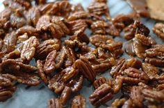 a pile of pecans sitting on top of a piece of paper