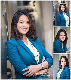 a woman with her arms crossed and wearing a blue blazer smiling at the camera