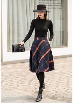 "This winter wool skirt is a classic piece of tailoring that will see you through rain or shine. It is cut with a flattering flared skirt to give you a wonderful shape. The winter skirt is perfect classic styling. This is a versatile skirt that you'll wear again and again. DETAILS: * 30% wool, 30% fiber, 40% polyester * fully satiny liner * Two side pockets * Right zip closure * A letter Back elastic, comfortable wear * Plus size full skirt * Perfect for Winter, autumn * Learn More about the ite Winter Knee-length Lined Pleated Skirt, Retro A-line Winter Skirt, Fall Workwear Full Mini Skirt, Full Mini Skirt For Workwear In Fall, Relaxed Fit Knee-length Mini Skirt For Fall, Knee-length Mini Skirt With Relaxed Fit For Fall, Elegant Winter Full Mini Skirt, Relaxed Knee-length Mini Skirt For Fall, Elegant Full Mini Skirt For Winter