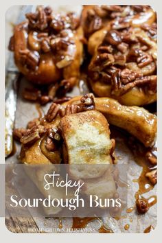 sticky sourdough buns with pecans and caramel drizzle on top