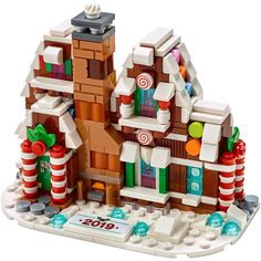 a lego christmas house with candy canes and candies