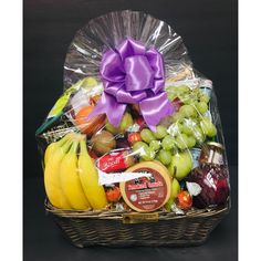 a basket filled with assorted fruits and snacks