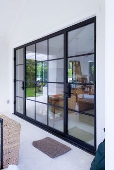 an open glass door leading to a living room