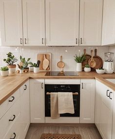 the kitchen is clean and ready for us to use it's new ovens