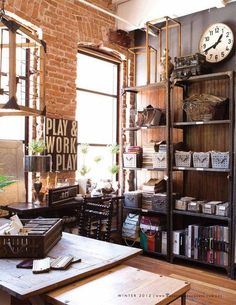 a living room filled with lots of furniture and a clock on top of a book shelf