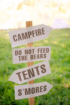 a sign that says campfire do not feed the bears tents s'mores