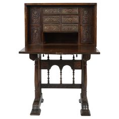 an old wooden desk with ornate carvings on the top and bottom, against a white background