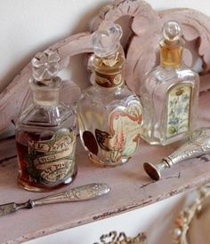 an old wooden shelf with antique bottles and other items on it, including a razor