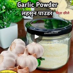 garlic powder in a glass jar next to garlic