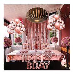 a birthday party with pink and gold decorations