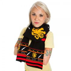 Add some magic to your wardrobe with this stylish Harry Potter Scarf! Featuring a Fair Isle design, this 100% acrylic knit scarf dons the House Gryffindor crest. Scarf measures 80" long; 7" wide. Gryffindor Symbol, Fair Isle Scarf, Gryffindor Crest, Harry Potter Scarf, Harry Potter Shop, Neck Scarf Tying, Harry Potter Merchandise, Harry Potter Gryffindor, Branded Scarves