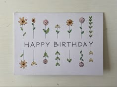 a happy birthday card with flowers on it