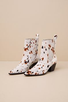 The Matisse Collins White Multi Speckle Calf Hair Leather Ankle Boots were made for walking with stylish confidence! Sleek, genuine calf hair leather (with a tan and black speckled cow-like print) shapes these pointed-toe boots that feature Western-inspired seaming. Elastic gusset panels accent the instep and outstep of the ankle-high shaft, while a pull tab at the back completes the slip-on silhouette. A classic stacked block heel lends the perfect cowgirl finish. 2. 5" stacked block heel. Ligh White Calf Hair Boots For Fall, Calf Hair Boots With Round Toe For Fall, Calf Hair Ankle Boots For Fall, Chic Leopard Print Leather Boots, White Suede Boots For Fall, Trendy Leopard Print Leather Boots, Leopard Print Leather Pointed Toe Boots, Leopard Print Leather Boots With Pointed Toe, Leopard Print Pointed Toe Leather Boots