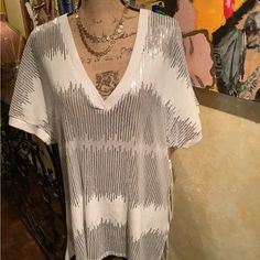 This Is A Fun And Jazzy Sequin Top. This Silver And White Top Can Be Paired With Many Pieces. Trimmed Neckline And Sleeves . 100% Polyester. White V-neck Top For Night Out, White V-neck Top For Party, White Sequined Blouse For Night Out, White Tops For Summer Night Out, Spring V-neck Tops With Sequins, Spring V-neck Sequin Tops, White Sequined Blouse For Spring, Spring White Sequin Blouse, Casual White Sequined Tops