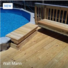 a wooden deck next to a swimming pool