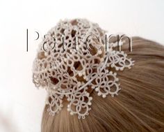 a close up of a woman's hair wearing a white crochet head piece