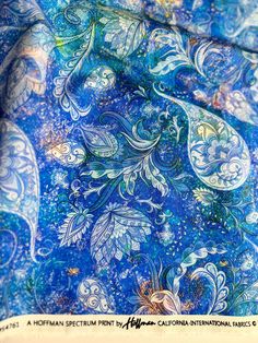 a blue and white paisley print fabric